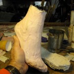 Em's foot being cast in urethane and fine aluminium powder