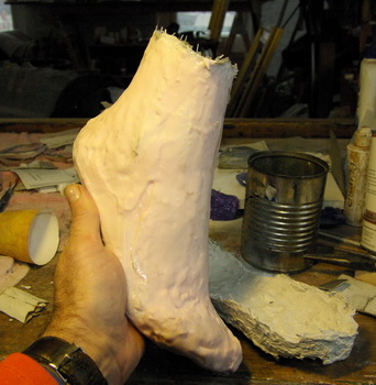 Em's foot being cast in urethane and fine aluminium powder